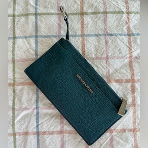 Michael Kors blue wallet with key ring.